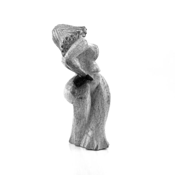 The figure seen from the side, with the dress flaring at the hem.