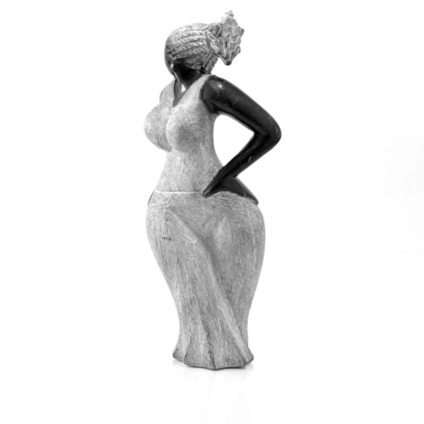 The figure seen from the front, with the textured hair and the polished dark face and arm.