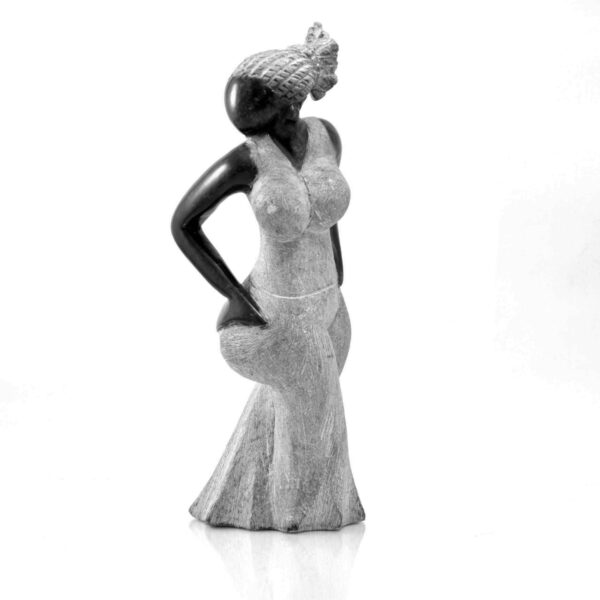 The figure seen from the other side, with the dress flaring at the hem.